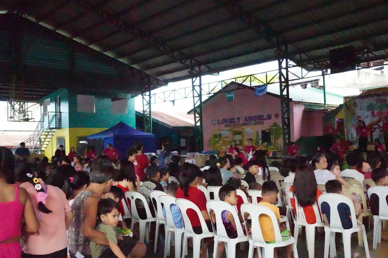 The youth worship band on stage, the youngest singers up front.