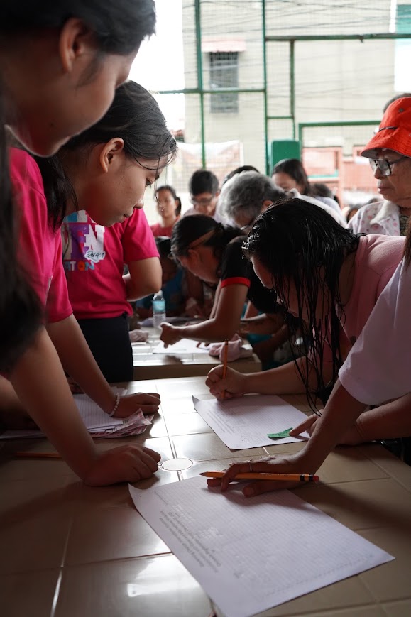 Young volunteers at the registration table.