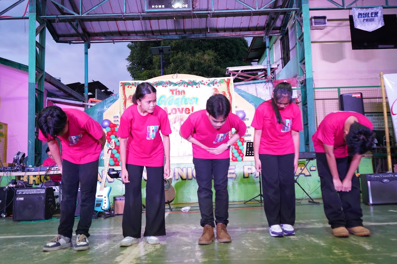 The dancers take a bow in front of the stage.