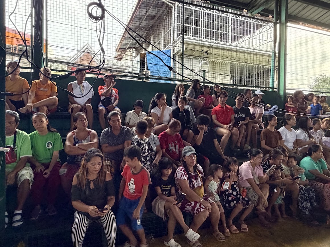 Families seated in the stands as the evening session gets under way.