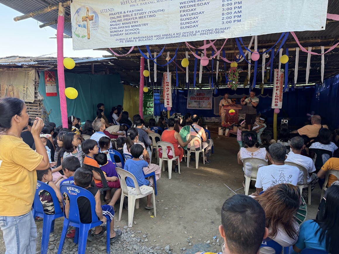 Families and children settle in for the Family Celebration service.