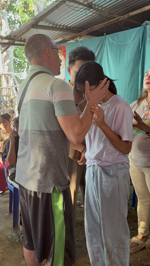 A close moment of prayer and blessing.