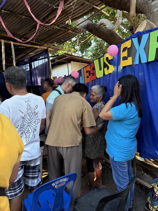 A close moment of prayer with one of the community's elders.