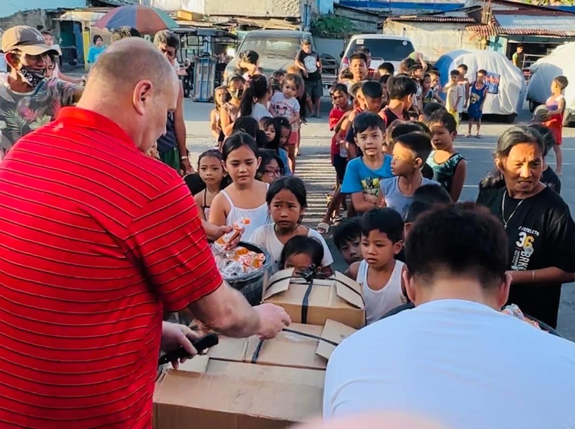 Cutting the straps on the boxes as the line closes in.