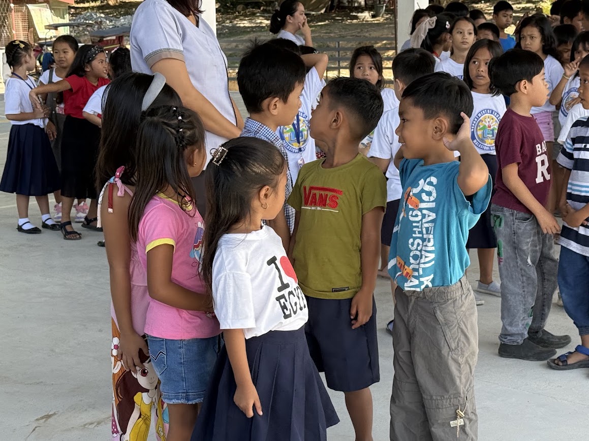 A moment of connection between the team and the children.