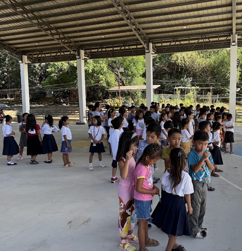 Students and teachers assembling for the program.