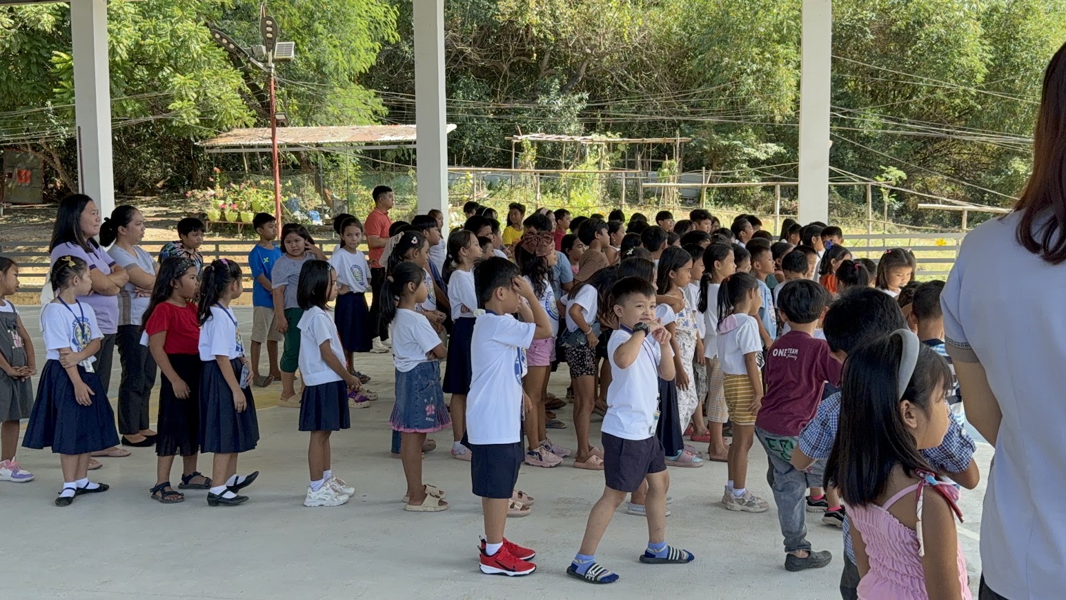 Teachers and students together, ready to begin.