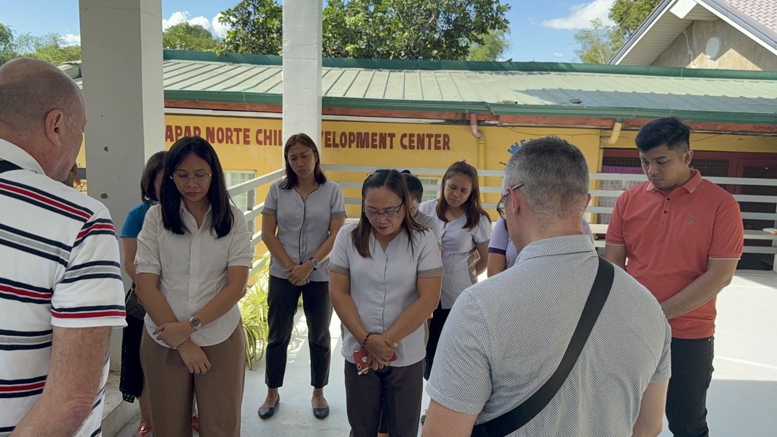 Praying together at the Palapar Norte Child Development Center.