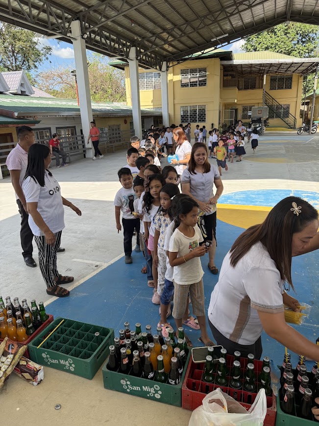 Waiting their turn at the distribution table.
