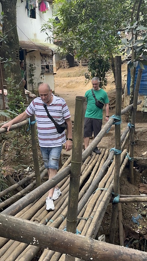 Crossing the bamboo bridge, a small shop at the far end.