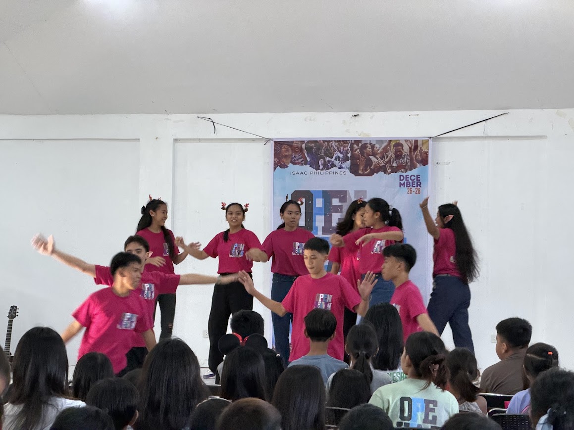 The youth dance team in reindeer antlers, mid-number.