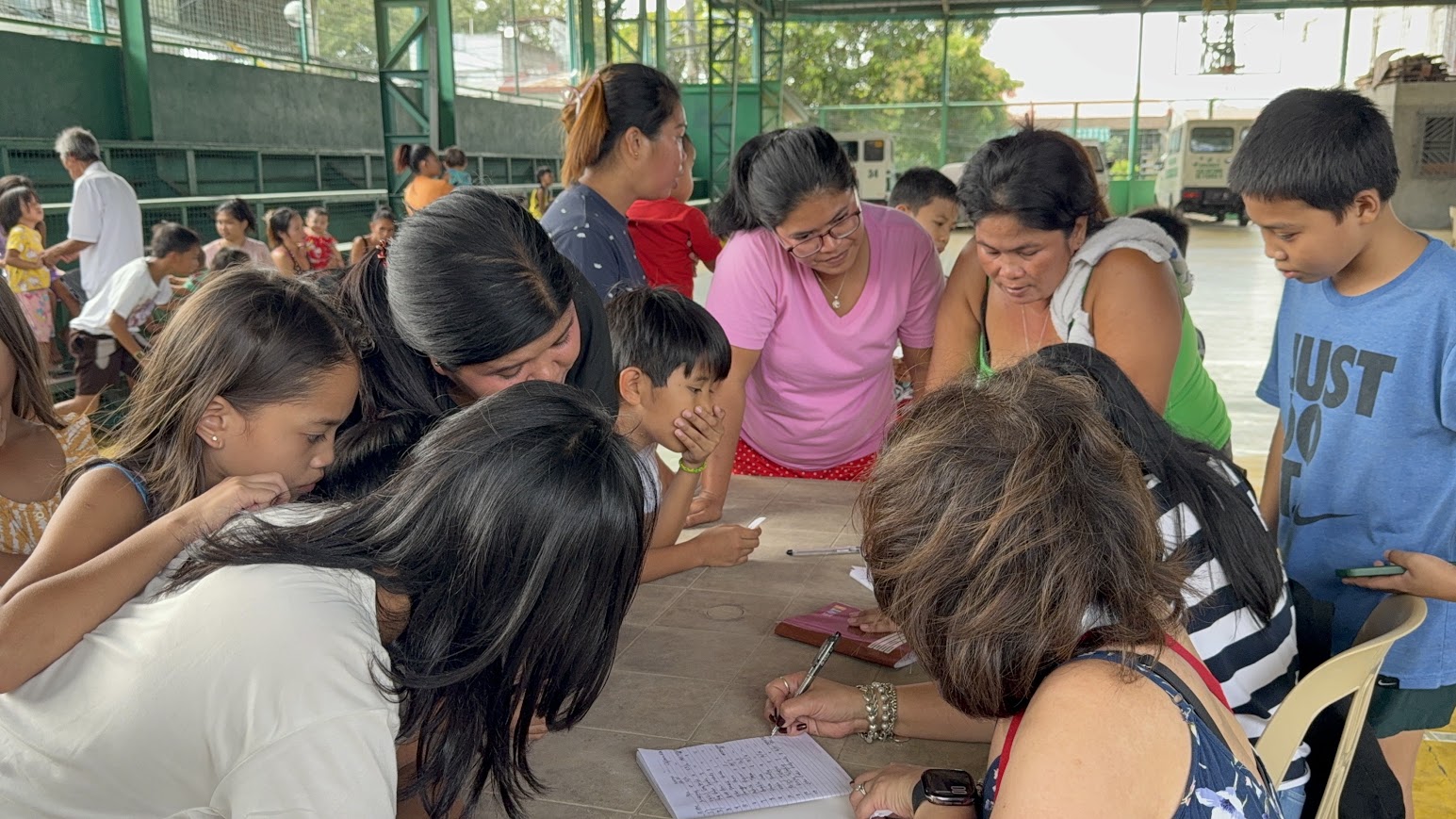 Signing in the first children of the afternoon.