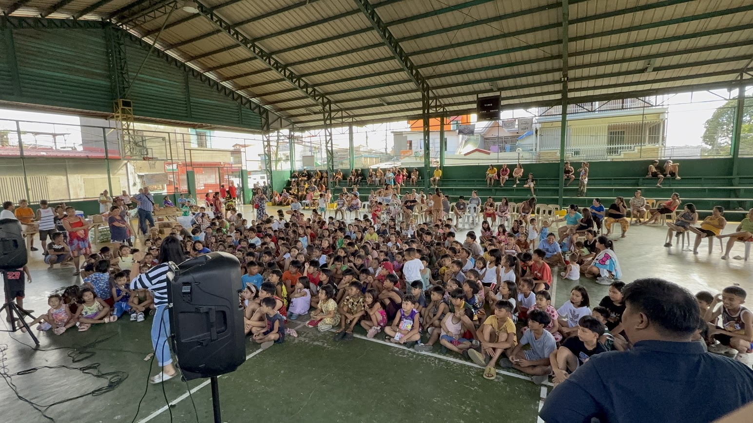 The whole court in frame as the message is shared.