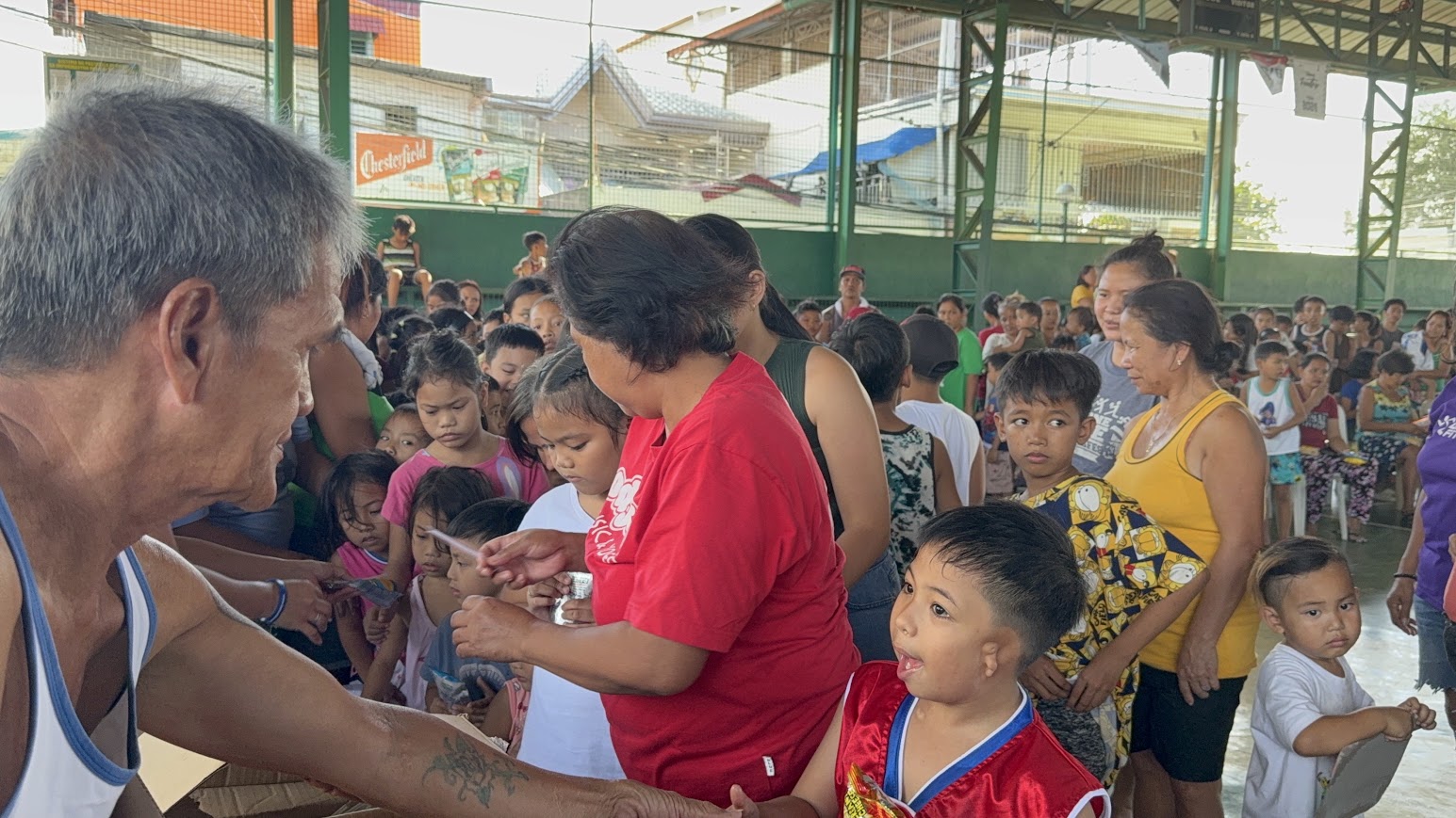 Snacks are handed out to the children.
