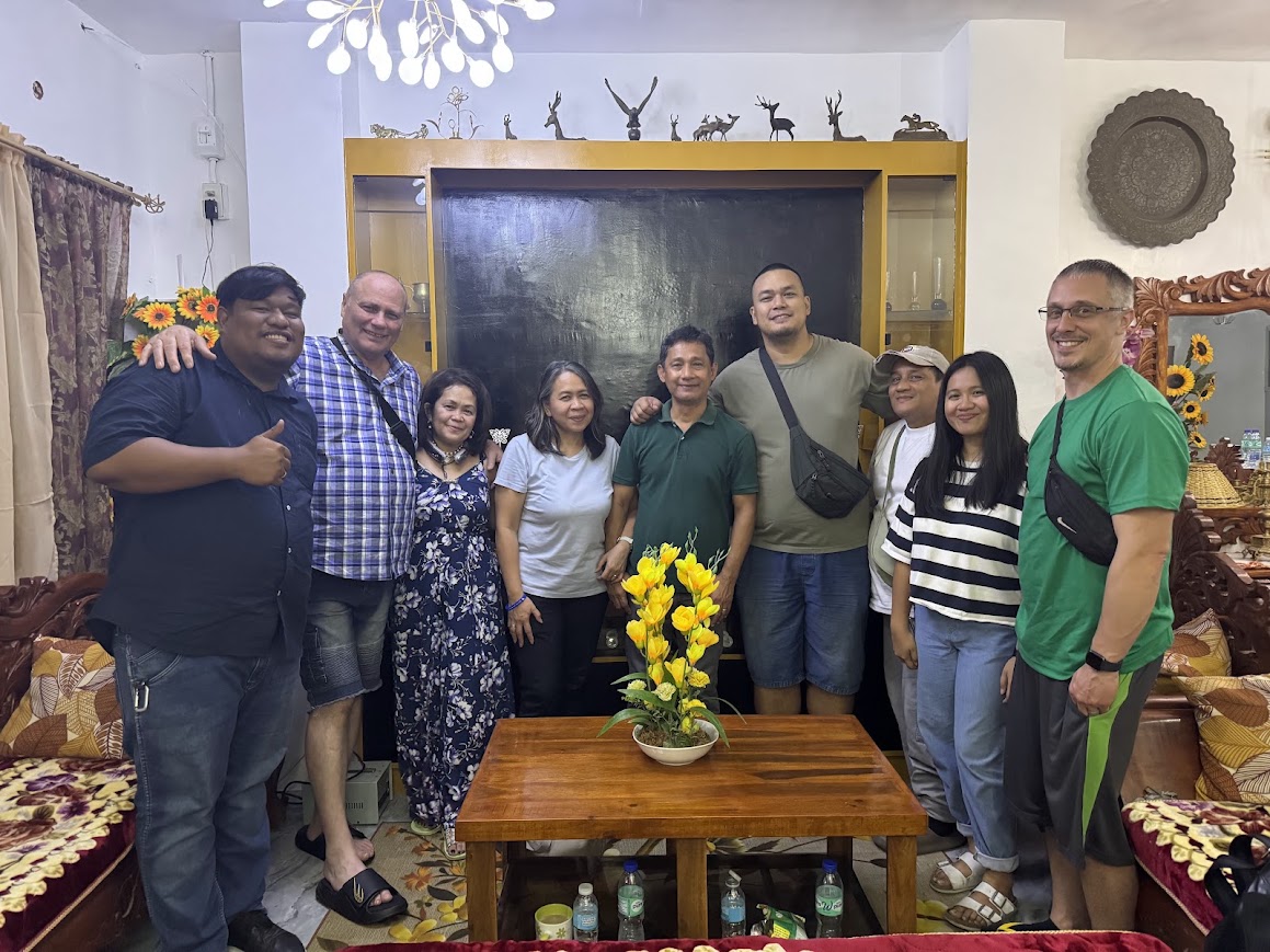 A home visit to close the day — gathered together in a family's living room.