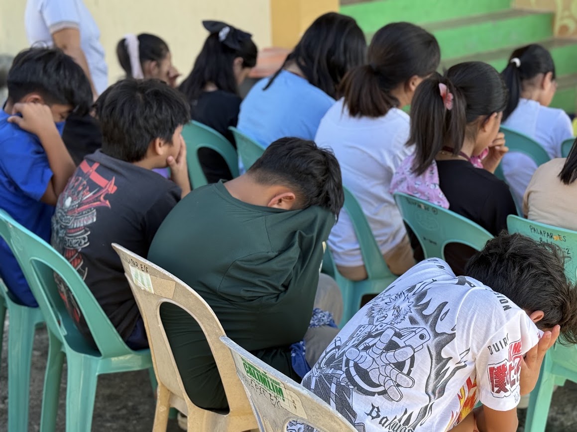 Students in a moment of quiet reflection.
